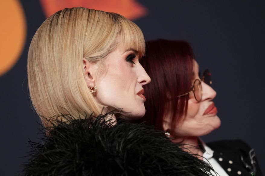 Kelly Osbourne, left and Sharon Osbourne pose for photographers upon arrival at the Brit Awards 2026 in Manchester, England, Saturday, Feb. 28, 2026. (Photo by Scott A Garfitt/Invision/AP)