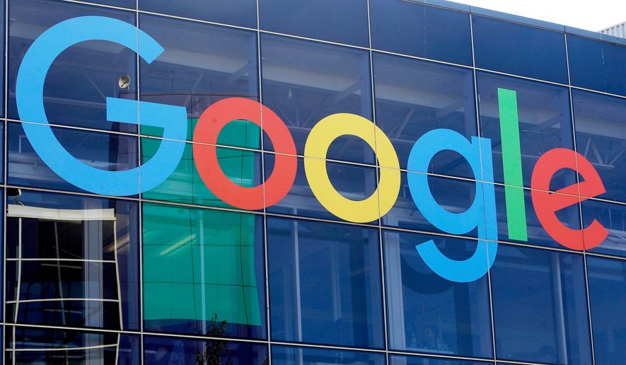 FILE - A sign is displayed on a Google building at their campus in Mountain View, Calif., Sept. 24, 2019. (AP Photo/Jeff Chiu, File)