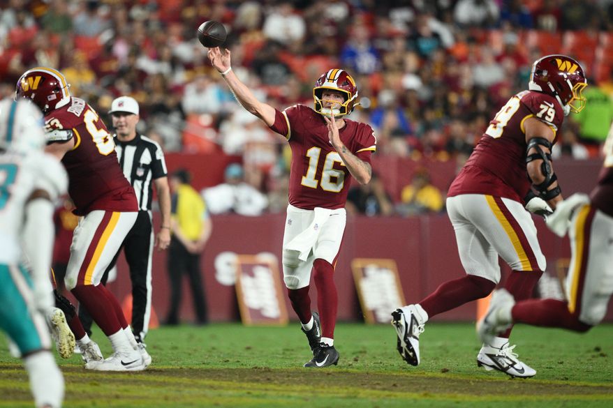 Washington Commanders quarterback Athan Kaliakmanis (16) throws a pass during the second half of an NFL preseason football game against the Miami Dolphins, Friday, Aug. 14, 2026, in Landover, MD. (AP Photo/Nick Wass)