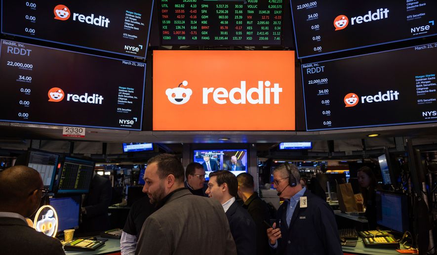 FILE - Reddit Inc. logos are displayed on the New York Stock Exchange trading floor, prior to the company's IPO, Thursday, March. 21, 2024. (AP Photo/Yuki Iwamura, File)