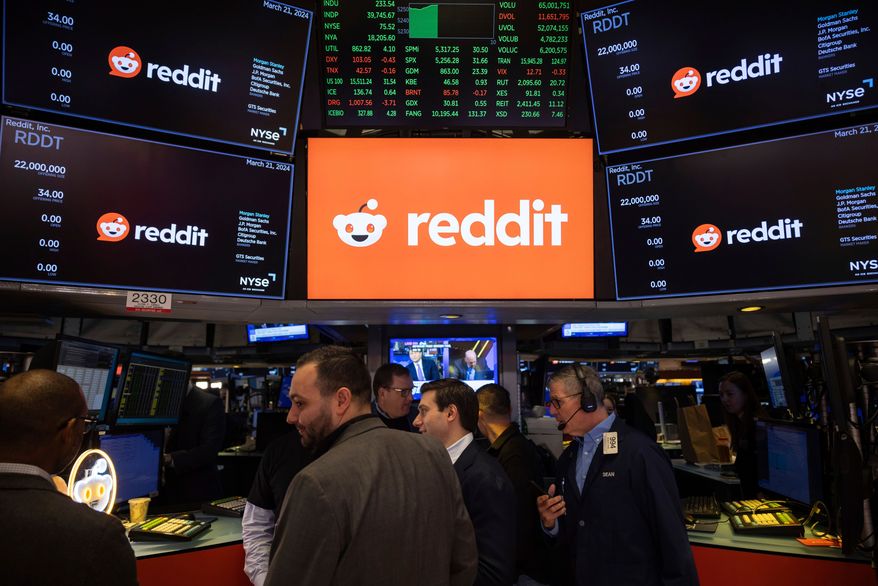 FILE - Reddit Inc. logos are displayed on the New York Stock Exchange trading floor, prior to the company's IPO, Thursday, March. 21, 2024. (AP Photo/Yuki Iwamura, File)
