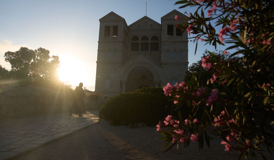 A priest enters the Basilica of the Transfiguration on Mount Tabor, northern Israel, on Aug. 6, 2026. (AP Photo/Ariel Schalit)