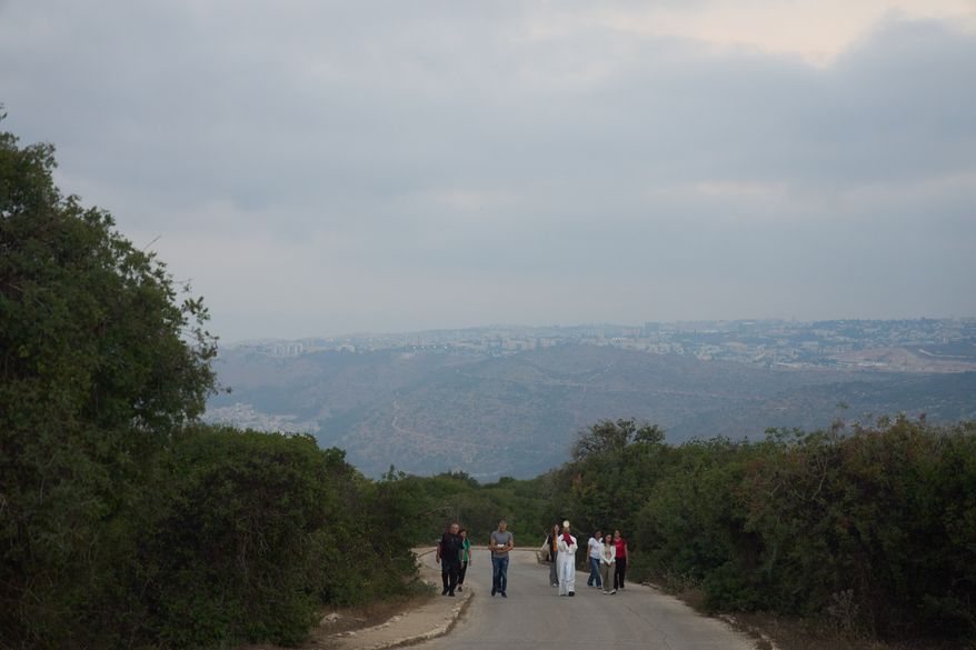 Rev. Fadi Shallufi leads Catholic pilgrims on a Eucharistic procession climbing to the Basilica of the Transfiguration on Mount Tabor, northern Israel, on Aug. 6, 2026. (AP Photo/Ariel Schalit)