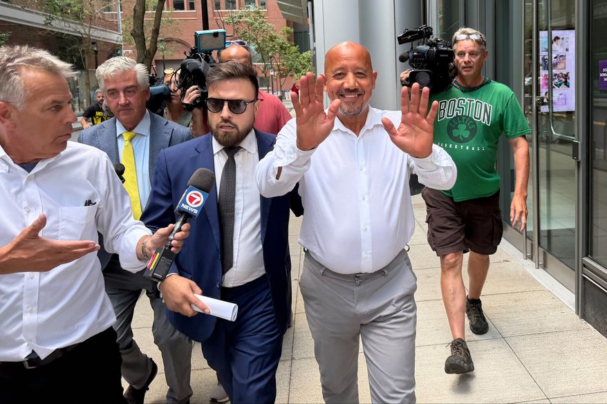 Lawrence, Mass., Mayor Brian DePena waves as he leaves federal court in Boston on Friday, Aug. 14, 2026, after making an initial appearance on charges that he fraudulently obtained a pandemic loan and using the money to fund election campaign, pay off high-interest mortgages and back taxes. (AP Photos/Michael Casey)