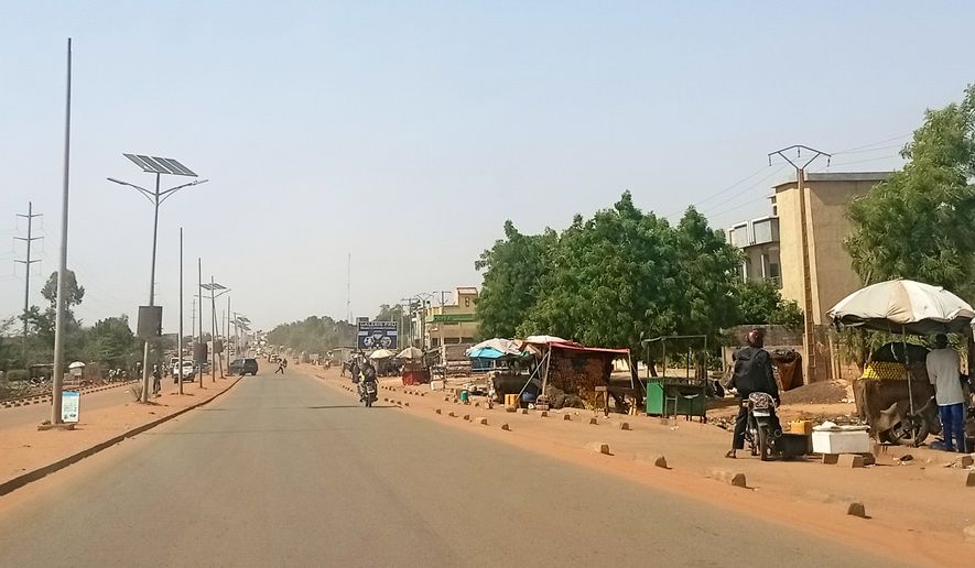 Motorcyclists ride along a street in Niamey, Niger, Thursday, June 18, 2026. (AP Photo, File)