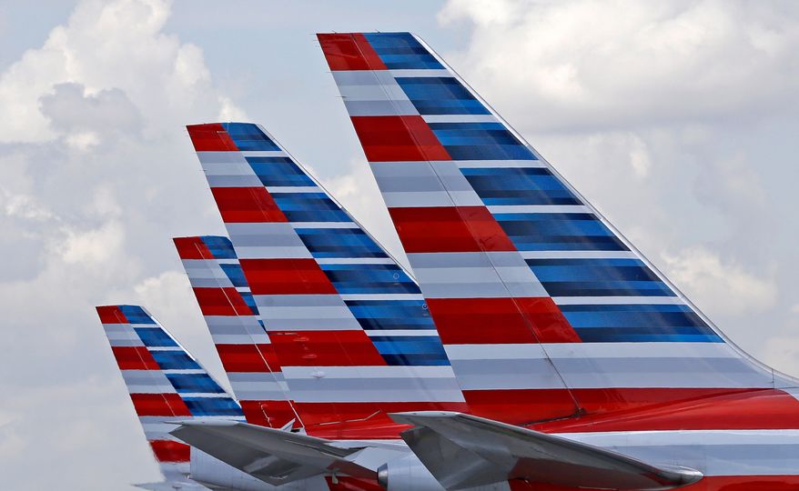 FILE - American Airlines passenger planes are parked at Miami International Airport, in Miami on July 17, 2015. (AP Photo/Alan Diaz, File)