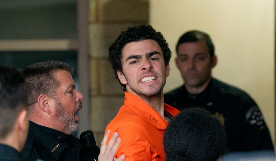 FILE - Suspect Luigi Mangione is taken into the Blair County Courthouse on Tuesday, Dec. 10, 2024, in Hollidaysburg, Pa. (Benjamin B. Braun/Pittsburgh Post-Gazette via AP, File)