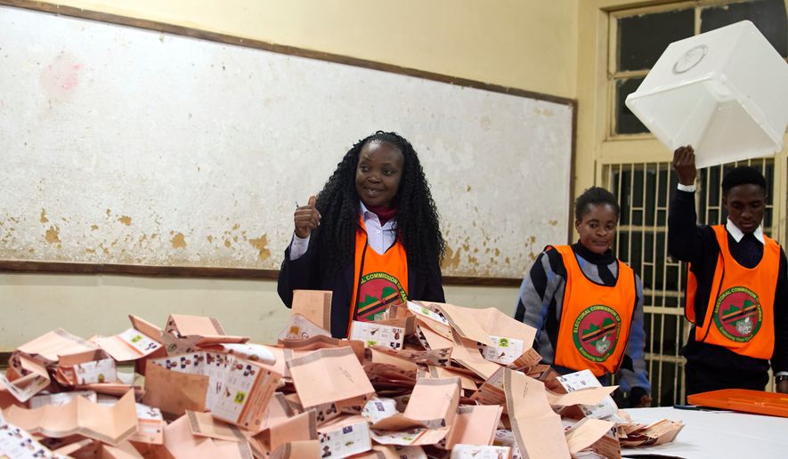 Election workers count ballots at a polling station in Lusaka, South Africa, Thursday, Aug. 13, 2026. (AP Photo/Alfonso Nqunjana)