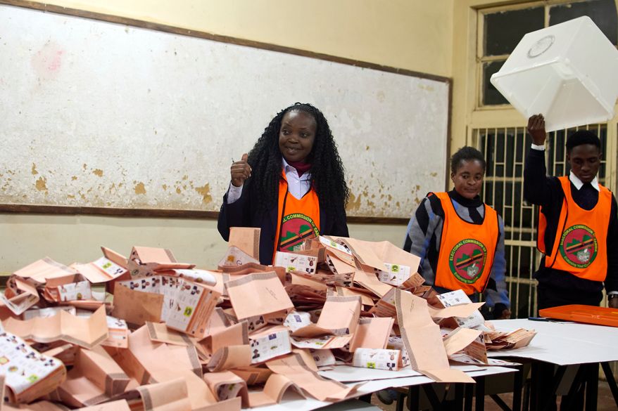 Election workers count ballots at a polling station in Lusaka, South Africa, Thursday, Aug. 13, 2026. (AP Photo/Alfonso Nqunjana)