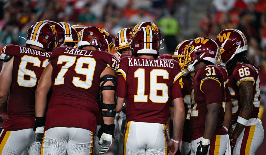 Washington Commanders quarterback Athan Kaliakmanis (16) huddles with the offense during the second half against the Miami Dolphins at Northwest Stadium in Landover, Maryland, August 14, 2026. (Photo by Brian Murphy for the Washington Times)