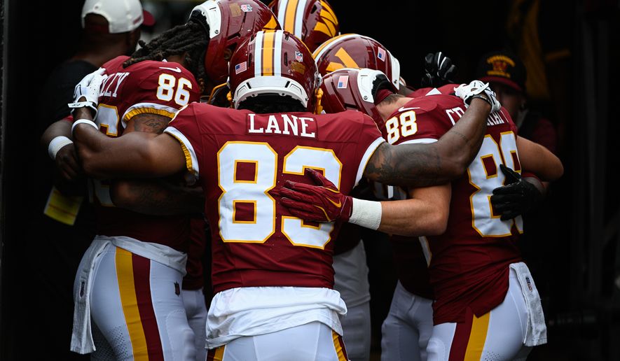 Washington Commanders receiver Jaylin Lane (83) huddles with his position group before hosting the Miami Dolphins at Northwest Stadium in Landover, Maryland, August 14, 2026. (Photo by Brian Murphy for the Washington Times)