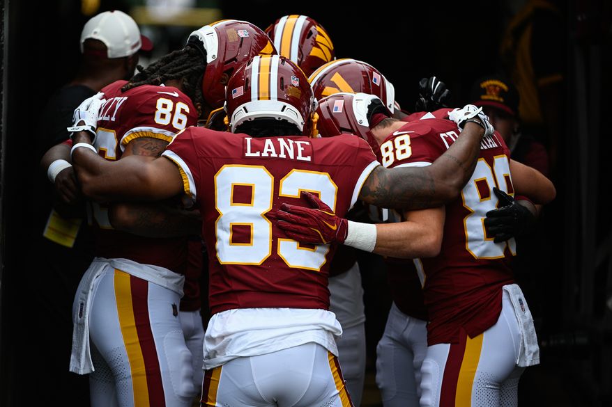 Washington Commanders receiver Jaylin Lane (83) huddles with his position group before hosting the Miami Dolphins at Northwest Stadium in Landover, Maryland, August 14, 2026. (Photo by Brian Murphy for the Washington Times)