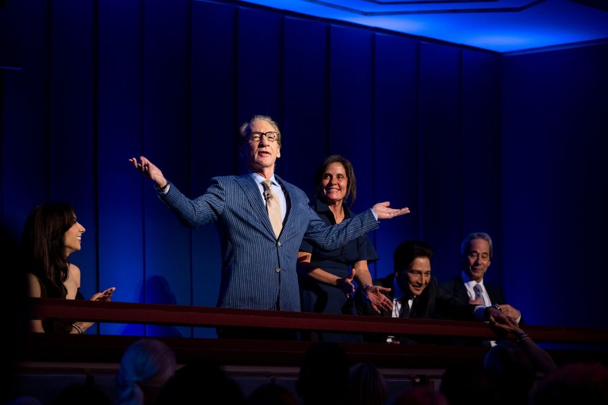 Comedian and political satirist Bill Maher motions to the audience at the start of the 27th Annual Mark Twain Prize for American Humor Celebrating Bill Maher, Sunday, June 29, 2026, in Washington. (AP Photo/Kevin Wolf)