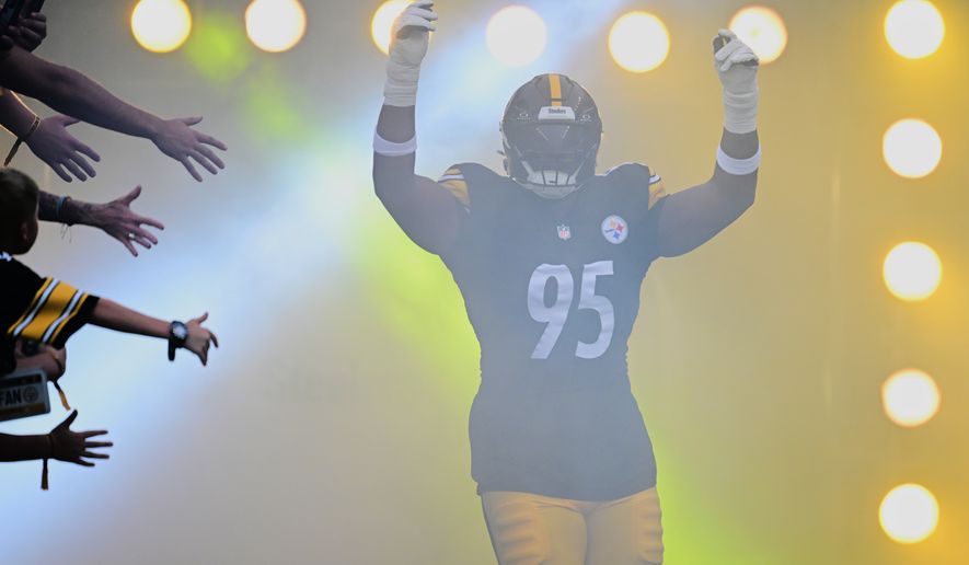 Pittsburgh Steelers defensive tackle Keeanu Benton runs out onto the field for a preseason NFL football game against the Green Bay Packers in Pittsburgh, Thursday, Aug. 13, 2026. (AP Photo/David Dermer)