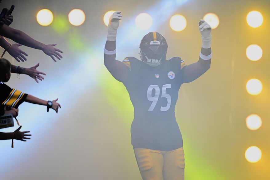 Pittsburgh Steelers defensive tackle Keeanu Benton runs out onto the field for a preseason NFL football game against the Green Bay Packers in Pittsburgh, Thursday, Aug. 13, 2026. (AP Photo/David Dermer)