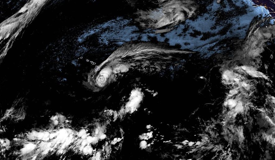 This satellite image released by NOAA shows Tropical Storm Lala over the Pacific Ocean, near Hawaii, Saturday, Aug. 15, 2026. (NOAA via AP)