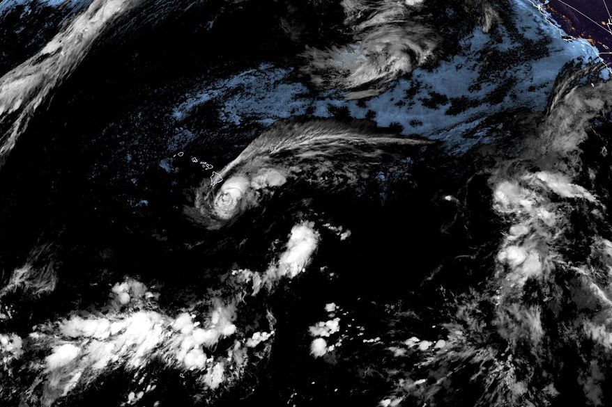 This satellite image released by NOAA shows Tropical Storm Lala over the Pacific Ocean, near Hawaii, Saturday, Aug. 15, 2026. (NOAA via AP)