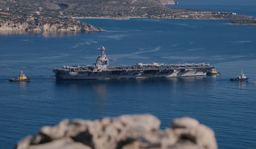 The USS Gerald R. Ford departs from Souda Naval Base near Chania on the island of Crete, Greece, Feb. 26, 2026. (AP Photo/Giannis Angelakis, File)
