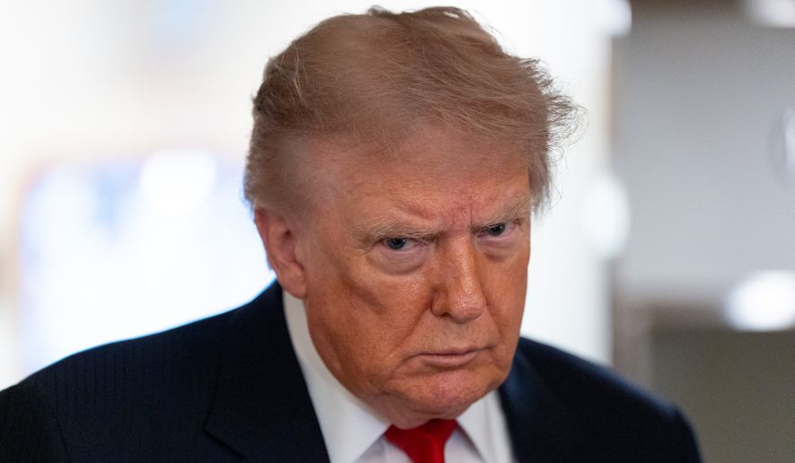 President Donald Trump speaks with reporters while on Air Force One en route to Oakland County International Airport, July 27, 2026, in Waterford Township, Mich. (AP Photo/Alex Brandon, File)
