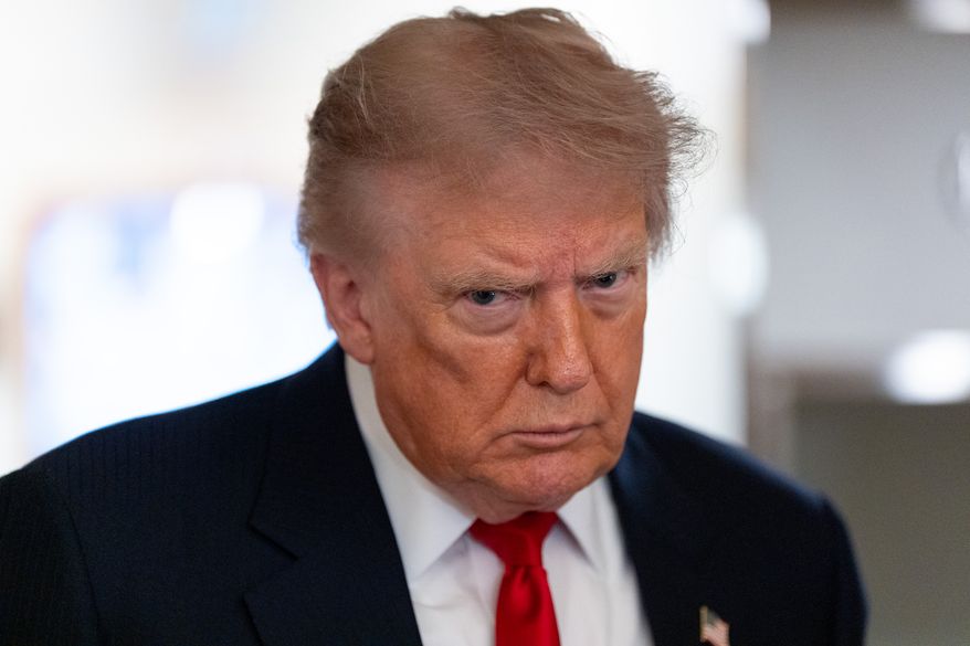 President Donald Trump speaks with reporters while on Air Force One en route to Oakland County International Airport, July 27, 2026, in Waterford Township, Mich. (AP Photo/Alex Brandon, File)