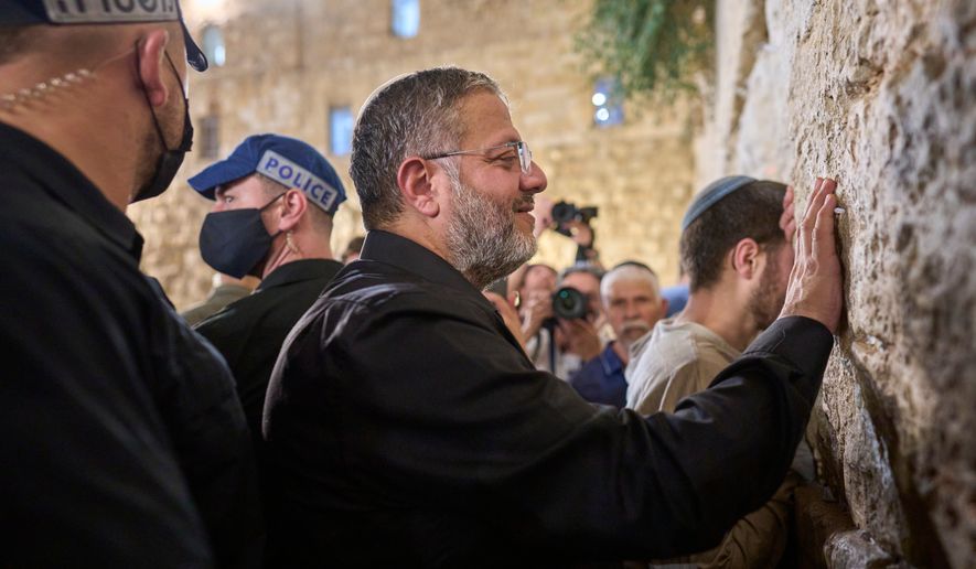 Israel's Minister of National Security, Itamar Ben-Gvir, prays during the mourning ritual of Tisha B'Av at the Western Wall, Judaism's holiest site, in Jerusalem's Old City, Wednesday, July 22, 2026. (AP Photo/Ohad Zwigenberg)