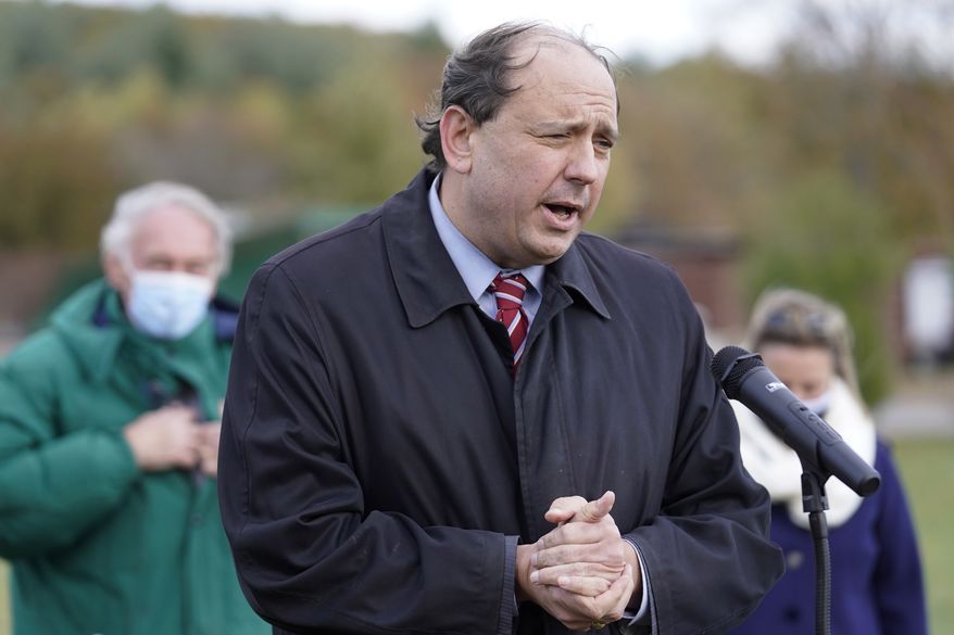 Mass. Democratic state Sen. Jamie Eldridge faces reporters as U.S. Sen. Edward Markey, D-Mass., left, looks on, Monday, Nov. 2, 2020, in Marlborough, Mass., during an event held to encourage voters to cast their ballots for democrats in the 2020 general election. (AP Photo/Steven Senne)