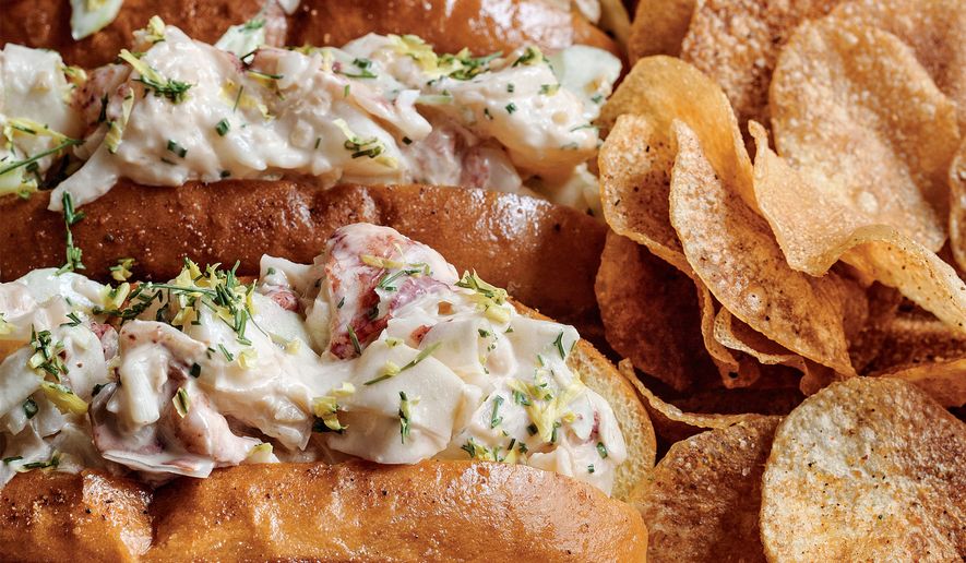 This image released by Voracious shows a recipe for lobster rolls from the cookbook "Home" by Bryan Voltaggio. (Ed Anderson/Voracious via AP)