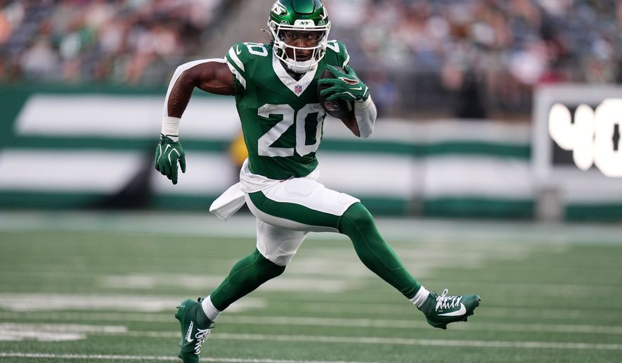 New York Jets running back Breece Hall runs up field during the first half of a preseason NFL football game against the Tampa Bay Buccaneers, Friday, Aug. 14, 2026, in East Rutherford, N.J. (AP Photo/Frank Franklin II)