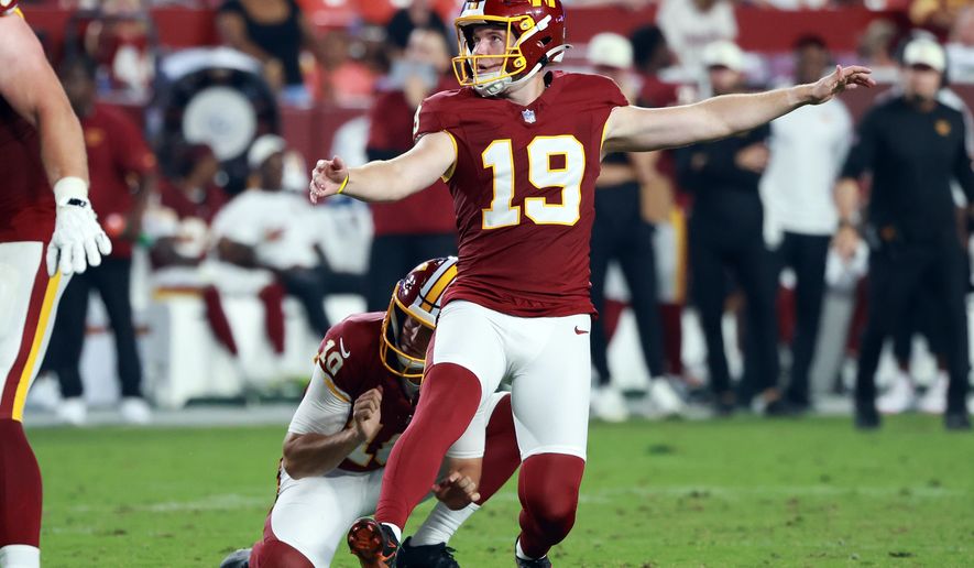 FILE - Washington Commanders place kicker Drew Stevens (19) kicks the ball during an NFL football game against the Miami Dolphins, Aug. 14, 2026 in Landover, Md. (AP Photo/Daniel Kucin Jr., File)