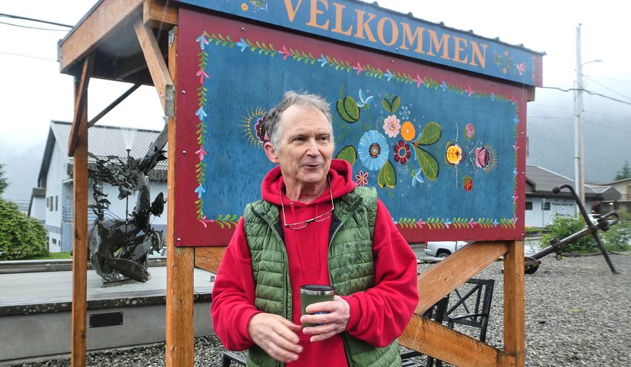 Dan Sullivan, a candidate in Alaska's U.S. Senate race who shares a name with the incumbent seeking reelection, talks in front of a welcome sign near downtown Petersburg, Alaska, Friday, July 3, 2026. (AP Photo/Becky Bohrer)
