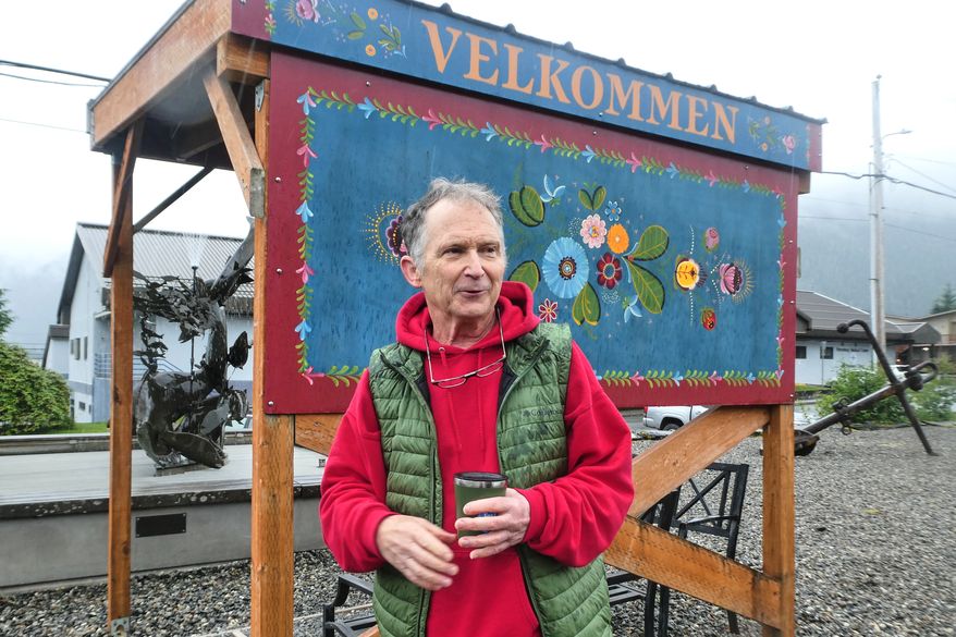 Dan Sullivan, a candidate in Alaska's U.S. Senate race who shares a name with the incumbent seeking reelection, talks in front of a welcome sign near downtown Petersburg, Alaska, Friday, July 3, 2026. (AP Photo/Becky Bohrer)