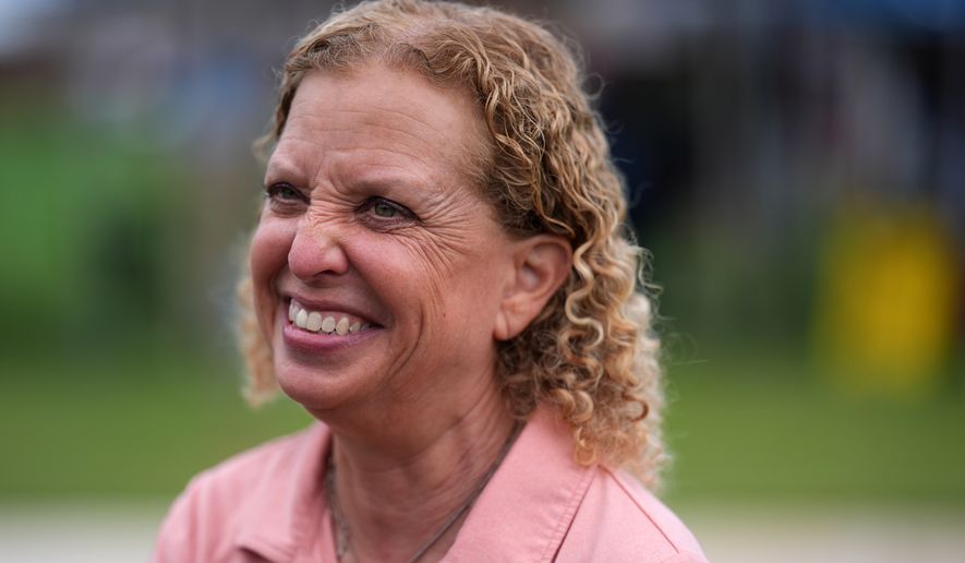 U.S. Rep. Debbie Wasserman Schultz smiles as she greets constituents at a National Night Out community event while campaigning for Florida's 20th congressional district, in Plantation, Fla., Tuesday, Aug. 4, 2026. (AP Photo/Rebecca Blackwell)