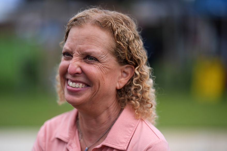 U.S. Rep. Debbie Wasserman Schultz smiles as she greets constituents at a National Night Out community event while campaigning for Florida's 20th congressional district, in Plantation, Fla., Tuesday, Aug. 4, 2026. (AP Photo/Rebecca Blackwell)