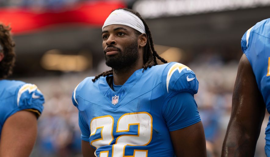 FILE - Los Angeles Chargers running back Najee Harris (22) stands for the National Anthem before an NFL football game against the Denver Broncos, Sept. 21, 2025, in Inglewood, Calif. (AP Photo/Kyusung Gong, File)
