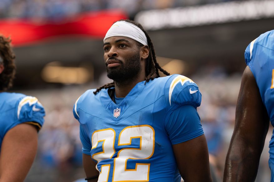 FILE - Los Angeles Chargers running back Najee Harris (22) stands for the National Anthem before an NFL football game against the Denver Broncos, Sept. 21, 2025, in Inglewood, Calif. (AP Photo/Kyusung Gong, File)