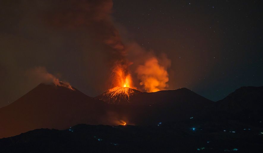 Eruptive activity continues on Mount Etna, where lava flows continue to descend on the slopes of the volcano, as seen from Mareneve near Catania, Italy, Thursday, Aug. 13, 2026. (AP Photo/Salvatore Allegra)