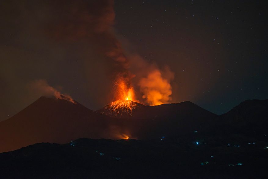 Eruptive activity continues on Mount Etna, where lava flows continue to descend on the slopes of the volcano, as seen from Mareneve near Catania, Italy, Thursday, Aug. 13, 2026. (AP Photo/Salvatore Allegra)
