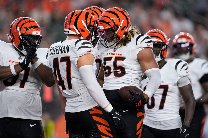 Cincinnati Bengals defensive end Cashius Howell (55) reacts with Swayzee Bozeman (47) after recovering a Detroit Lions fumble during the first half of a preseason NFL football game Thursday, Aug. 13, 2026, in Cincinnati. (AP Photo/Carolyn Kaster)