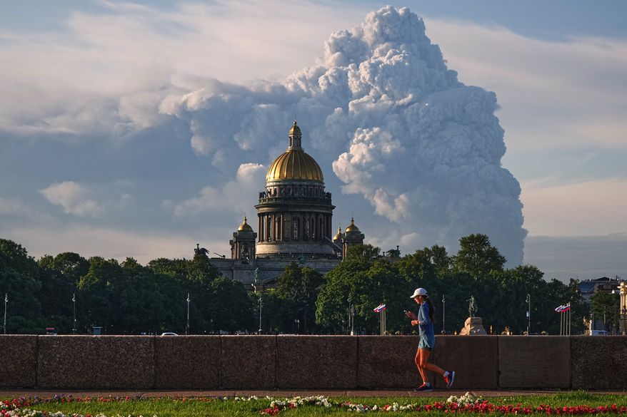 FILE - Smoke rises following a Ukrainian drone attack on a warehouse for online retailer Wildberries in St. Petersburg, Russia on Friday, July 24, 2026, with St. Isaac's Cathedral seen in foreground. (UGC via AP, File)