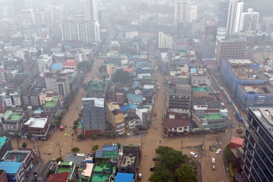 The partly flooded street by heavy rain is seen in Geoje, South Korea, Monday, Aug. 17, 2026. (Kim Dong-min/Yonhap via AP)