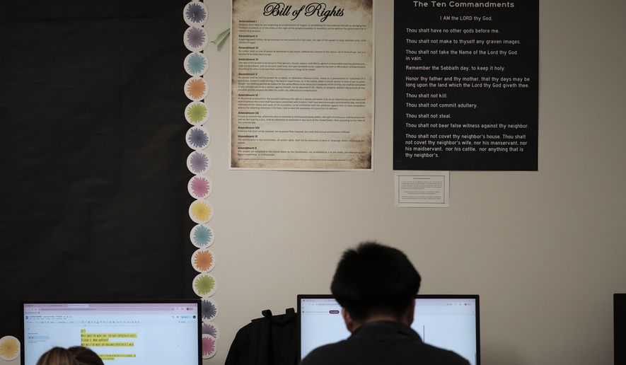 Students work under Ten Commandments and Bill of Rights posters on display in a classroom at Lehman High School in Kyle, Texas, Oct. 16, 2025. (AP Photo/Eric Gay, file)