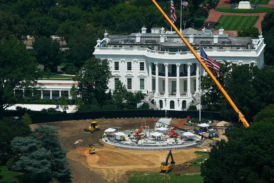 Construction continues on a helipad on the South Lawn of the White House, Monday, Aug. 17, 2026, in Washington. (AP Photo/Julia Demaree Nikhinson)