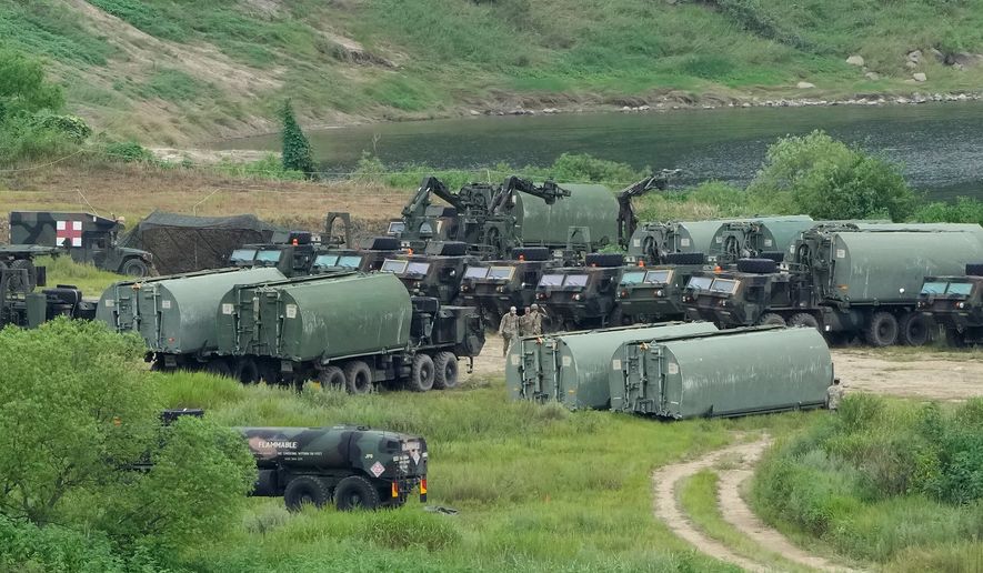 U.S. Army's armored vehicles gather to cross a river at a training field in Yeoncheon, South Korea, near the border with North Korea, Monday, Aug. 17, 2026. (AP Photo/Ahn Young-joon)