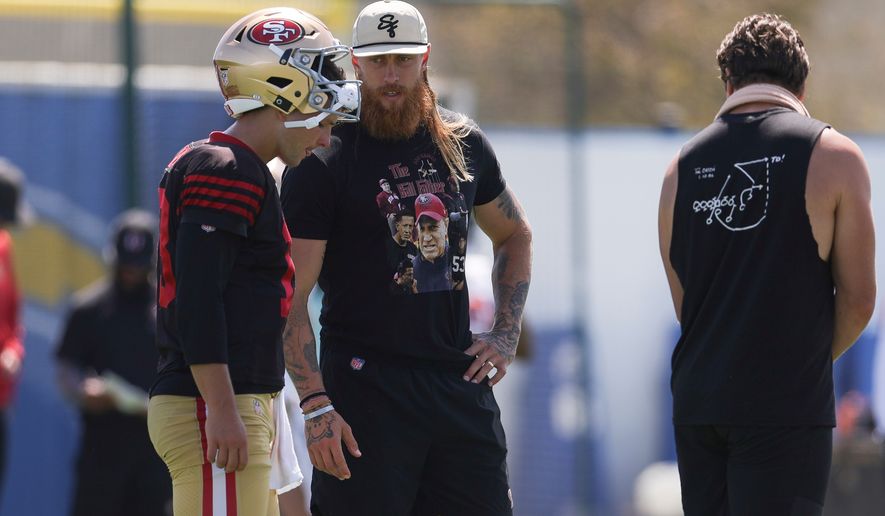 San Francisco 49ers quarterback Brock Purdy (13) talks with tight end George Kittle during a joint NFL football practice with the Los Angeles Chargers, Tuesday, Aug. 18, 2026, in El Segundo, Calif. (AP Photo/Ryan Sun)