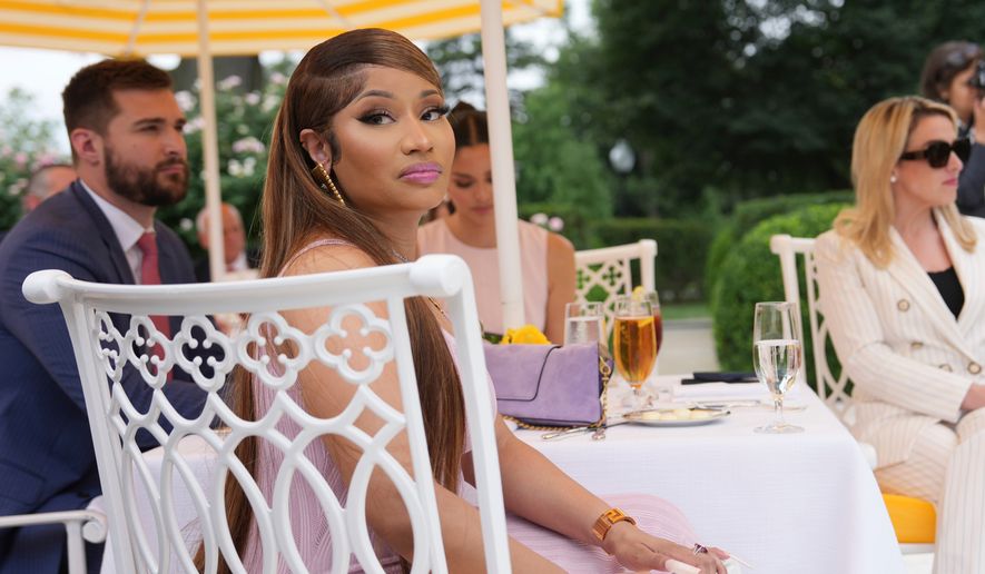 Nicki Minaj listens as President Donald Trump speaks at a lunch in the White House Rose Garden, Monday, July 6, 2026, in Washington. (AP Photo/Julia Demaree Nikhinson)