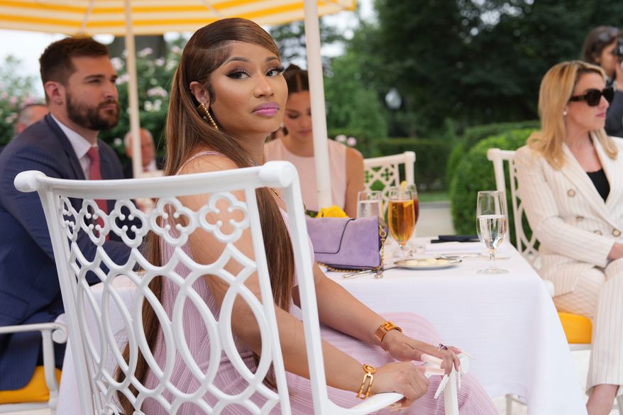 Nicki Minaj listens as President Donald Trump speaks at a lunch in the White House Rose Garden, Monday, July 6, 2026, in Washington. (AP Photo/Julia Demaree Nikhinson)