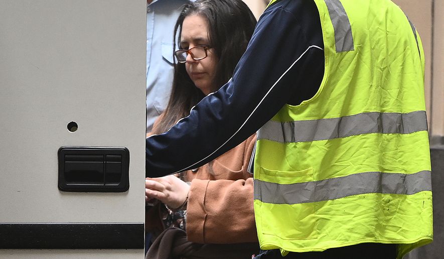FILE - Erin Patterson is escorted away from the Supreme Court of Victoria in Melbourne, Australia, on Sept. 8, 2025. (Joel Carrett/AAP Image via AP, File)