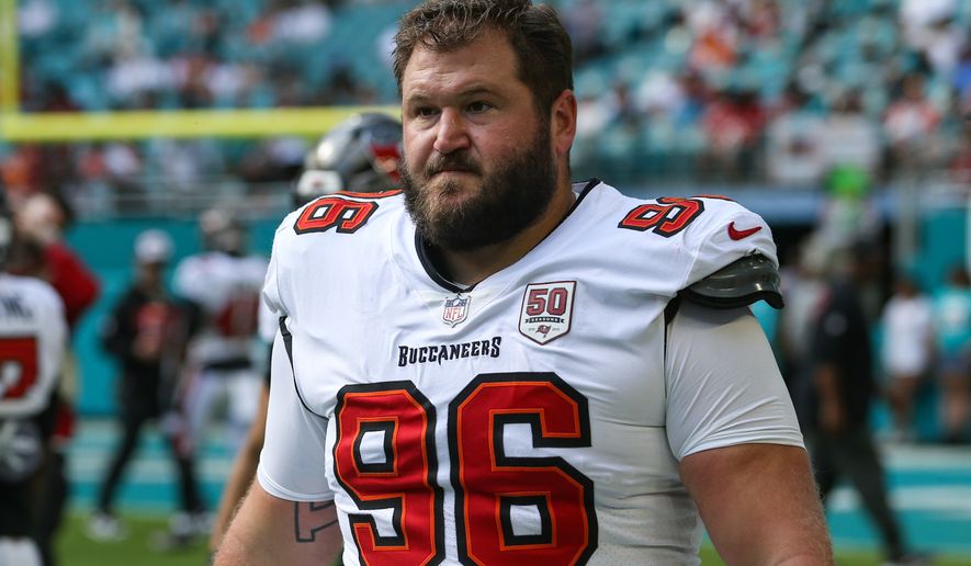 FILE - Tampa Bay Buccaneers defensive tackle Greg Gaines (96) warms up before an NFL football game against the Miami Dolphins, Dec. 28, 2025, in Miami Gardens, Fla. (AP Photo/Gary McCullough, File)