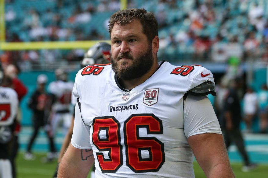 FILE - Tampa Bay Buccaneers defensive tackle Greg Gaines (96) warms up before an NFL football game against the Miami Dolphins, Dec. 28, 2025, in Miami Gardens, Fla. (AP Photo/Gary McCullough, File)