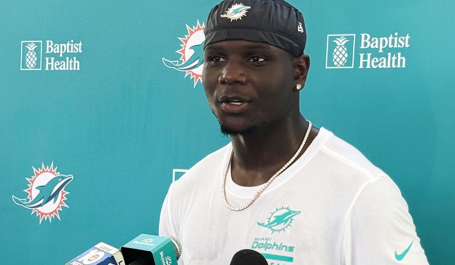Miami Dolphins wide receiver Chris Bell speaks with media after practice at the NFL football team's training camp, Tuesday, Aug. 18, 2026, in Miami Gardens, Fla. (AP Photo/Alanis Thames)